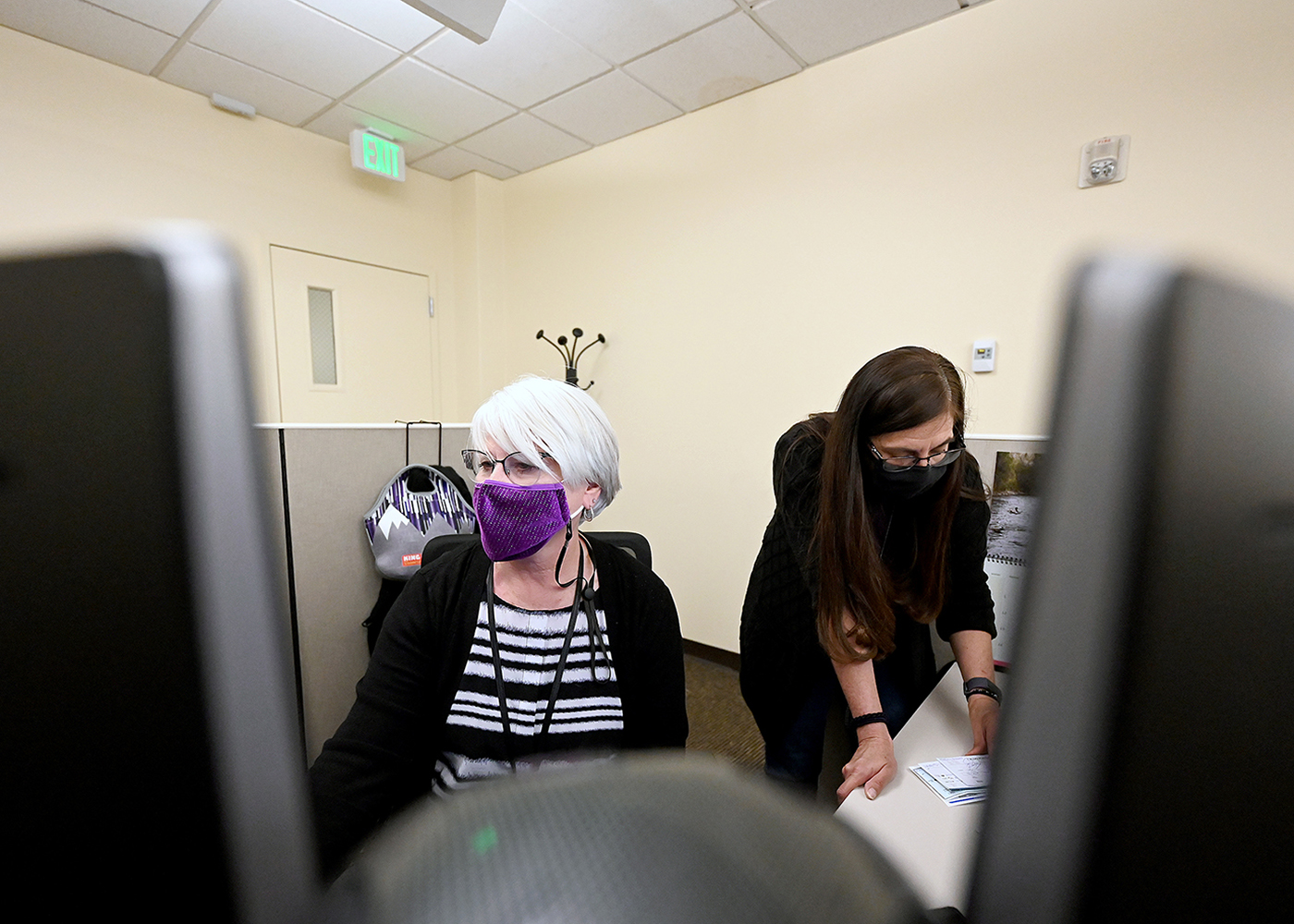 DMV Team Members work in an office