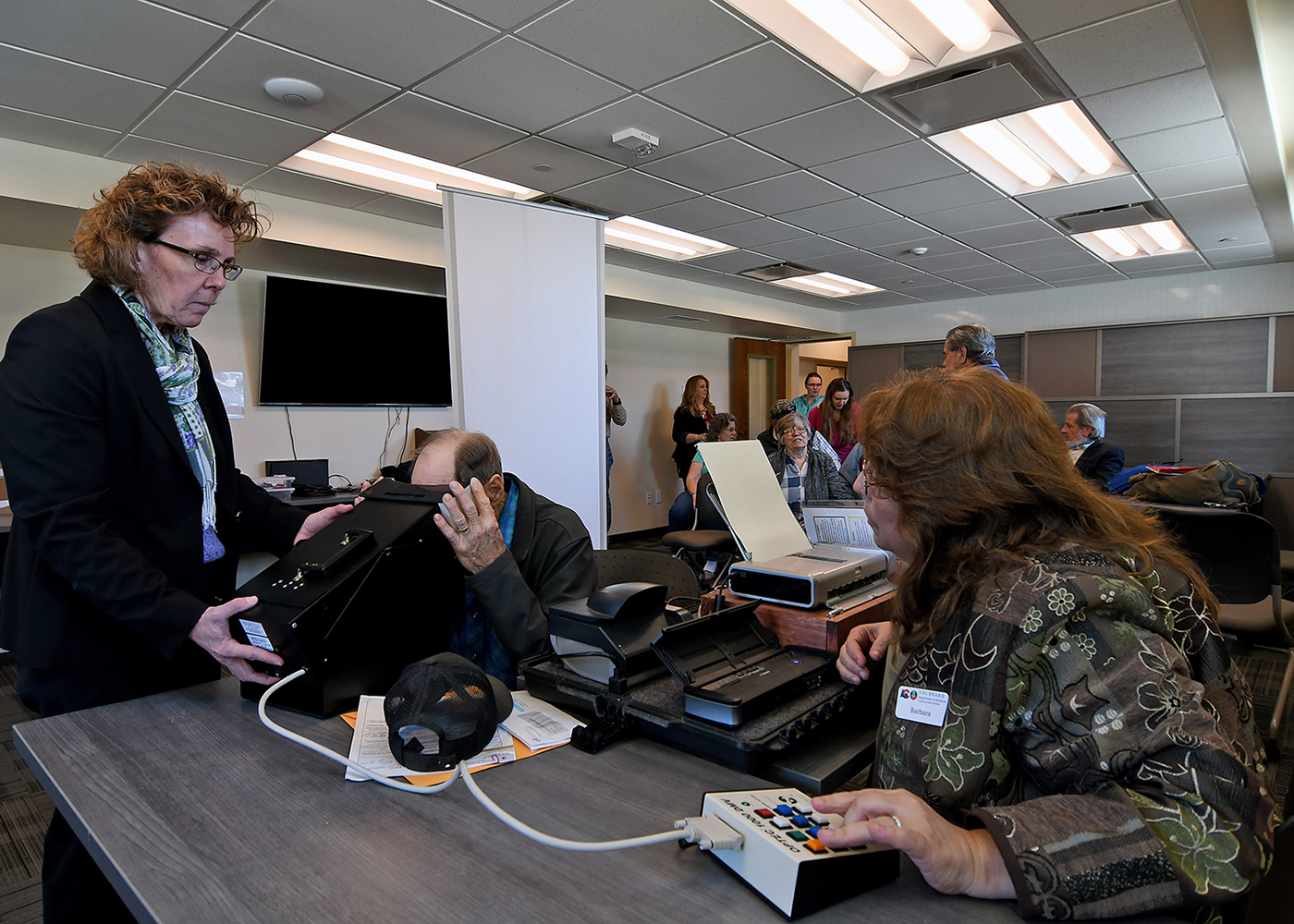  DMV Team Members administer a vision screening