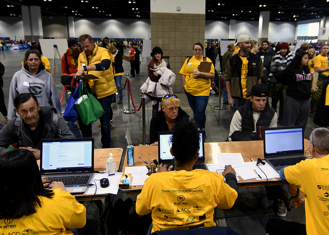 DMV Team Members volunteer as people line up in front of them